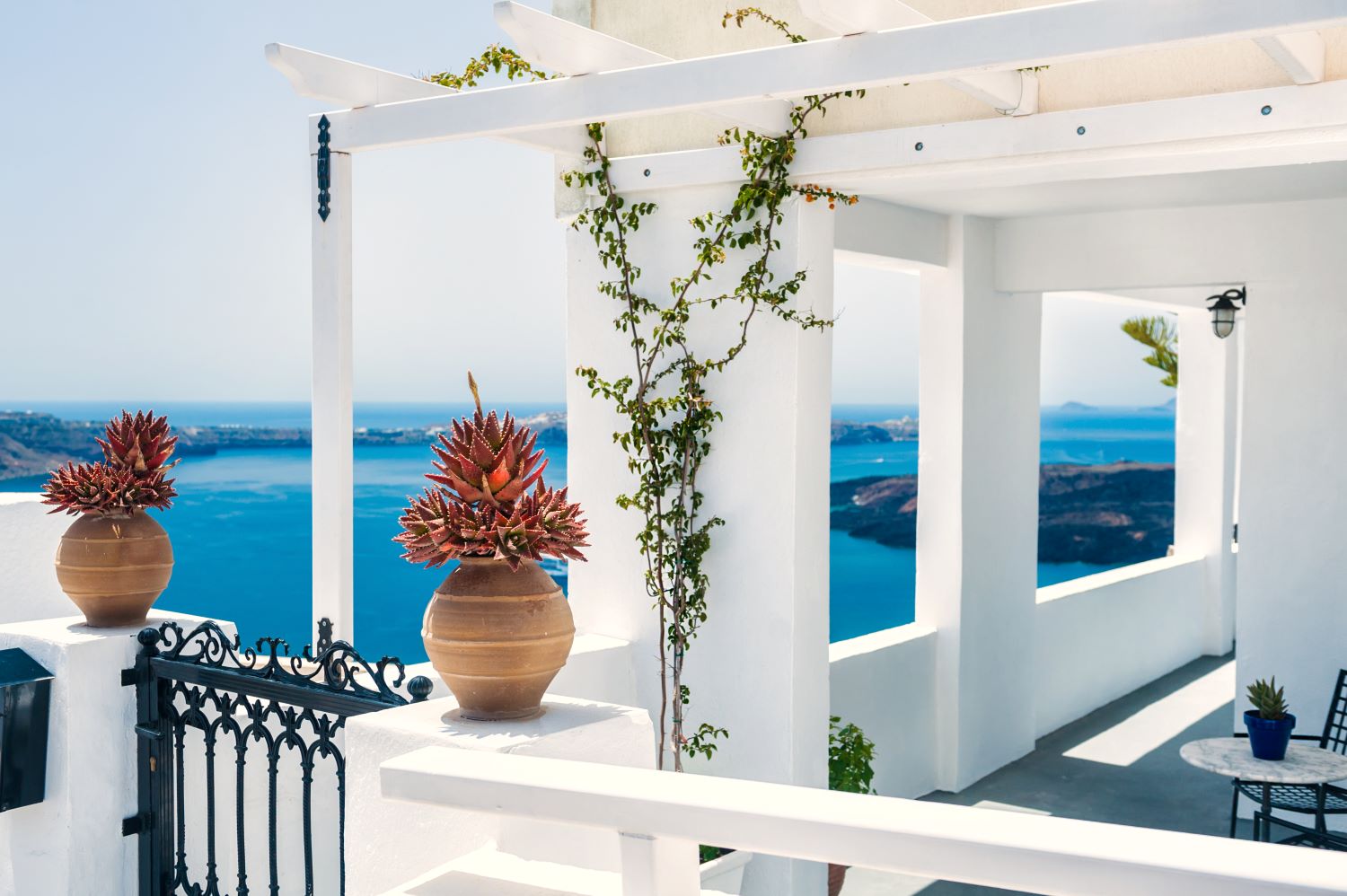 greek-house-with-terrace-sea-view-white-architecture-santorini-island-greece-beautiful-summer-landscape